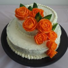 Carrot Cake with Carved Carrot and Cucumber Flowers